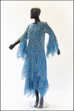 1970s blue floral print festival dress with handkerchief sleeves and skirt. Alexandra King vintage