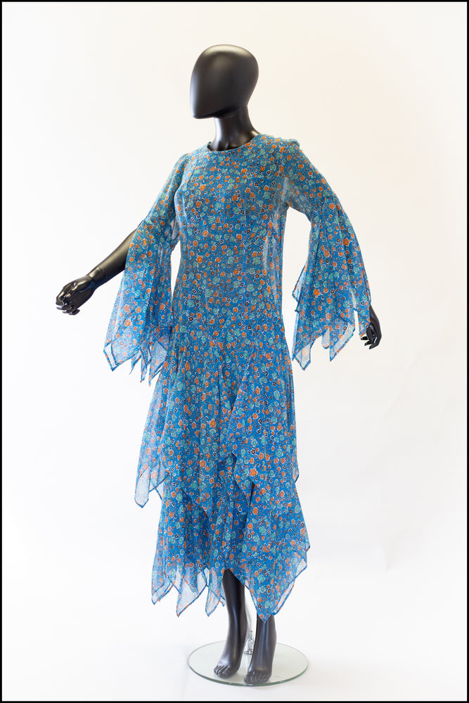 1970s blue floral print festival dress with handkerchief sleeves and skirt. Alexandra King vintage