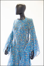 1970s blue floral print festival dress with handkerchief sleeves and skirt. Alexandra King vintage