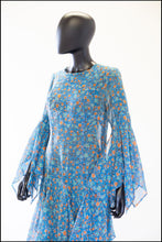 1970s blue floral print festival dress with handkerchief sleeves and skirt. Alexandra King vintage