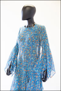 1970s blue floral print festival dress with handkerchief sleeves and skirt. Alexandra King vintage