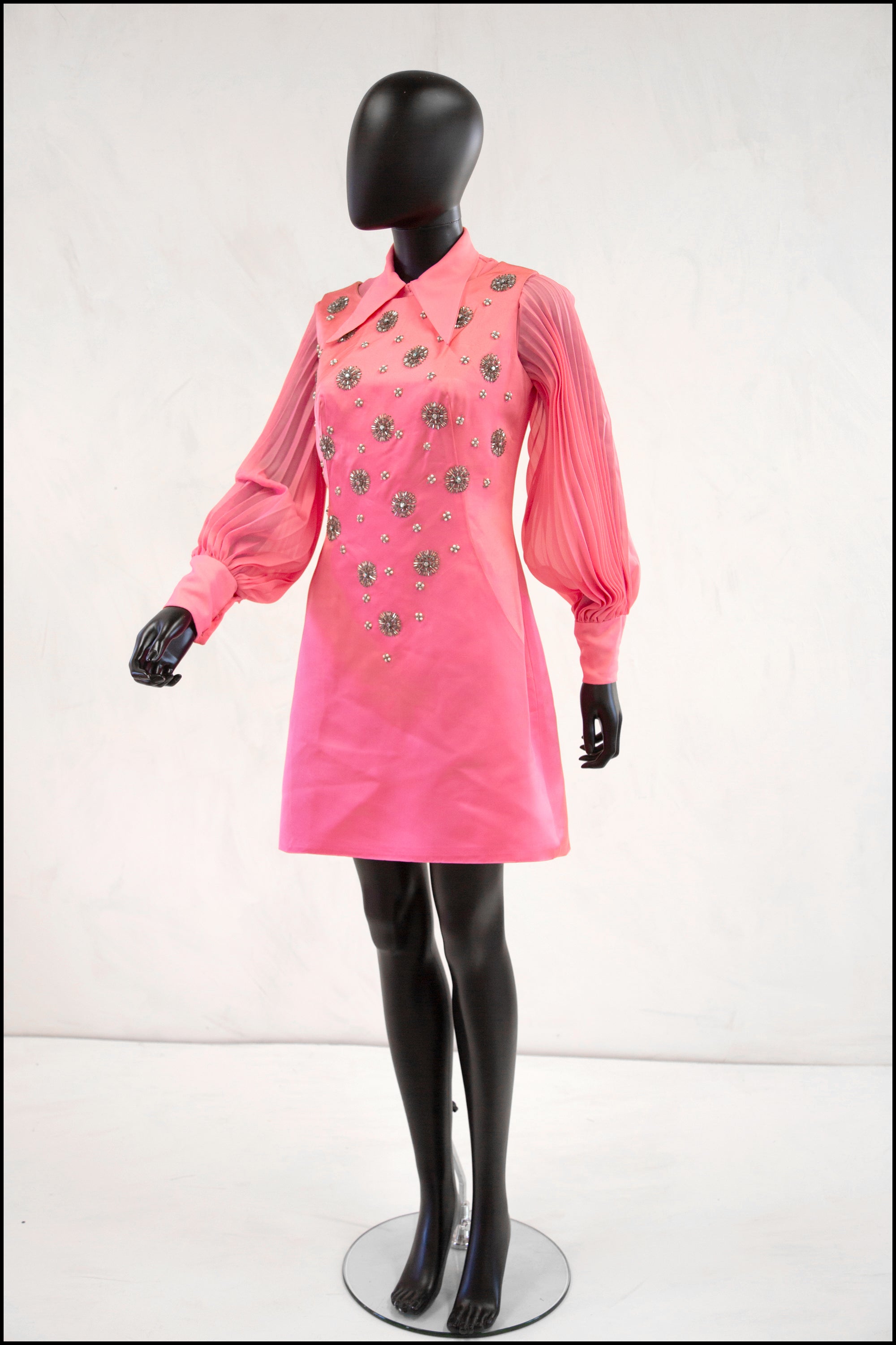 Where could I find 60s inspired mini dresses like the pink one