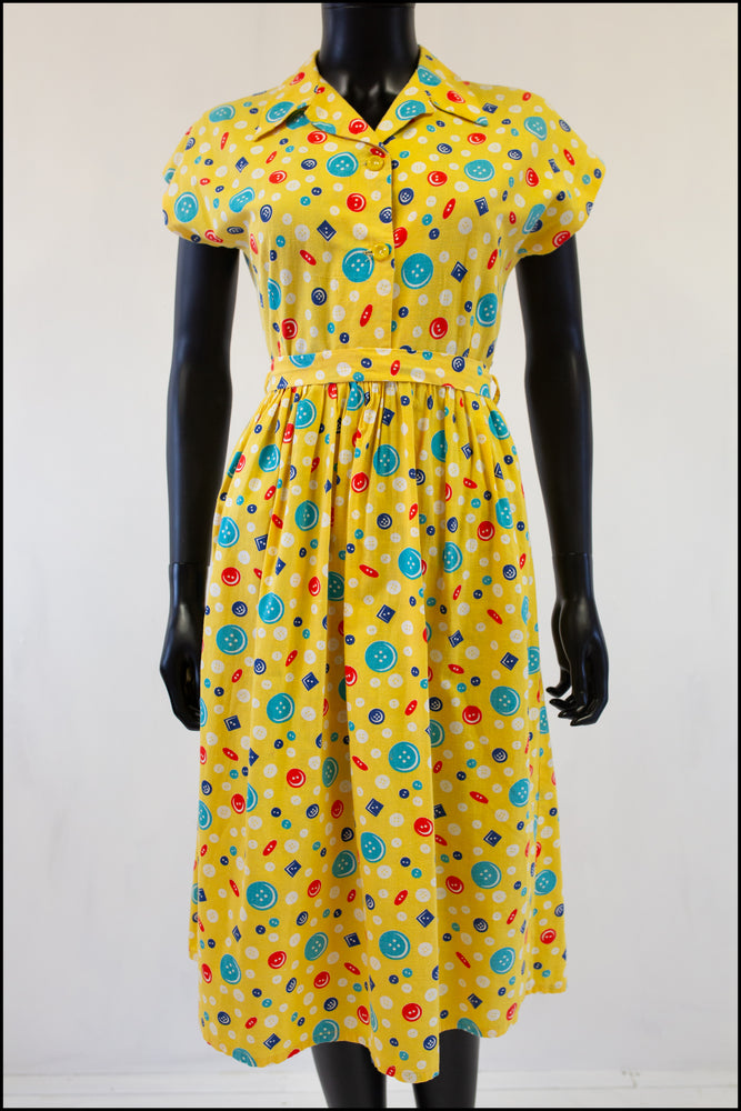vintage 1940s yellow cotton shirt dress with novelty print