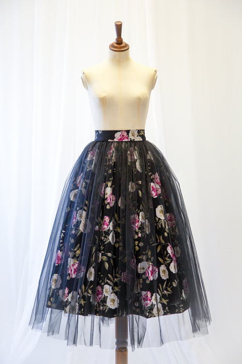 Black floral tulle skirt on a mannequin against a white background