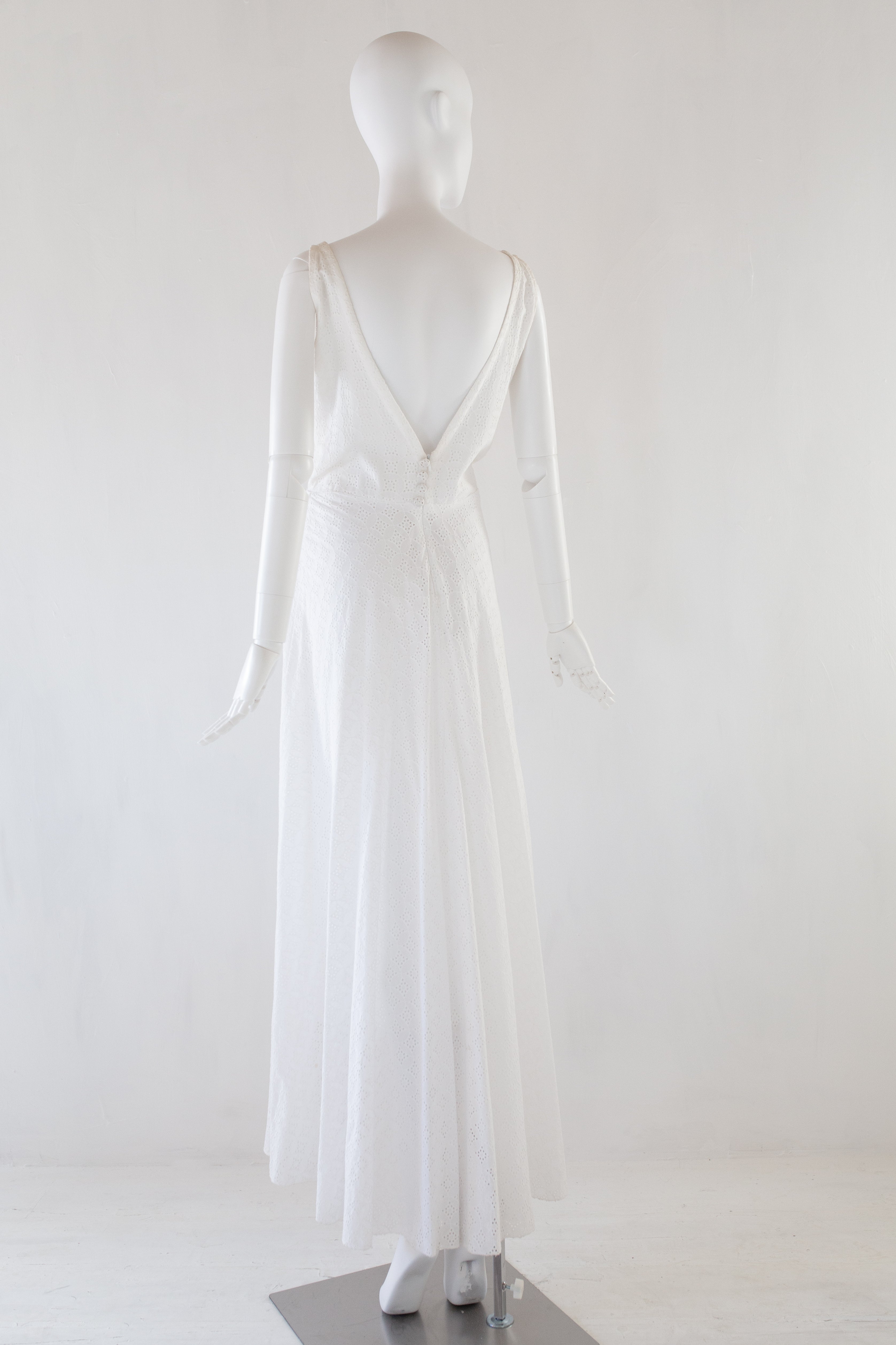 White dress on a mannequin against a white background