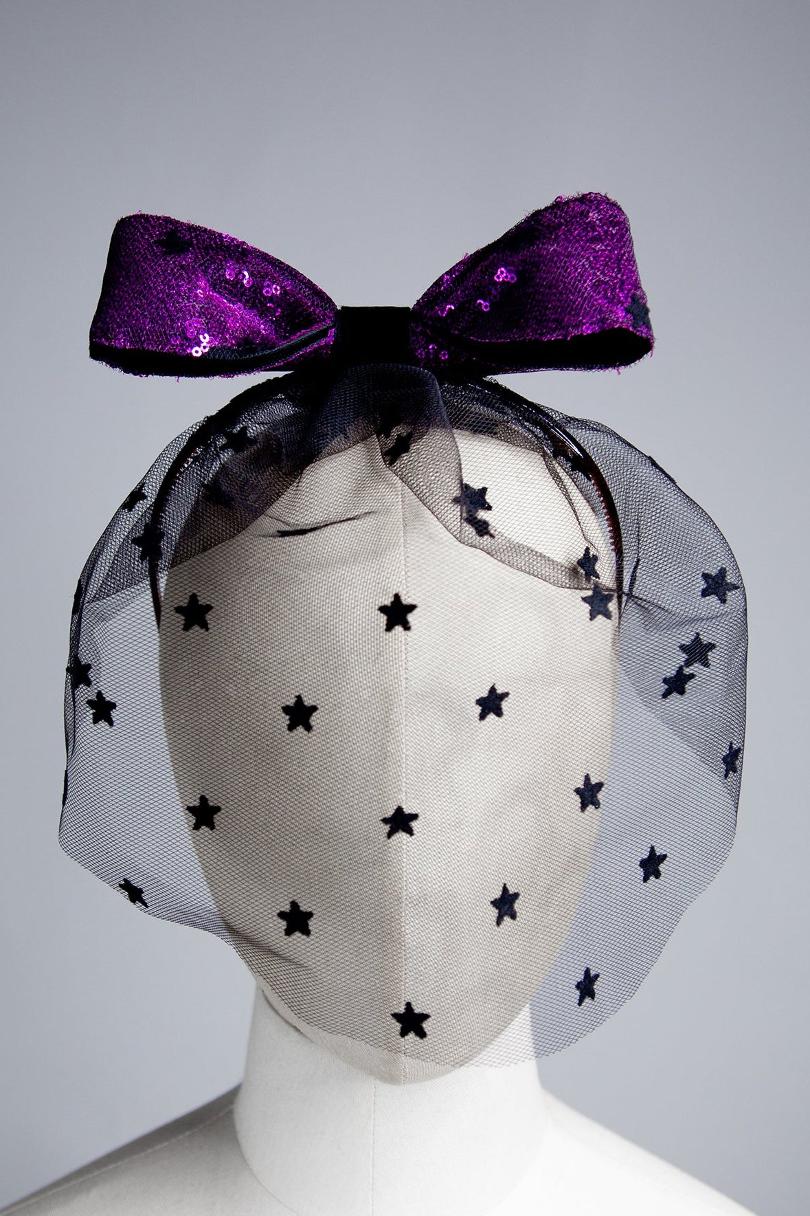 black vintage face veil with pink sequin bow fascinator hat
