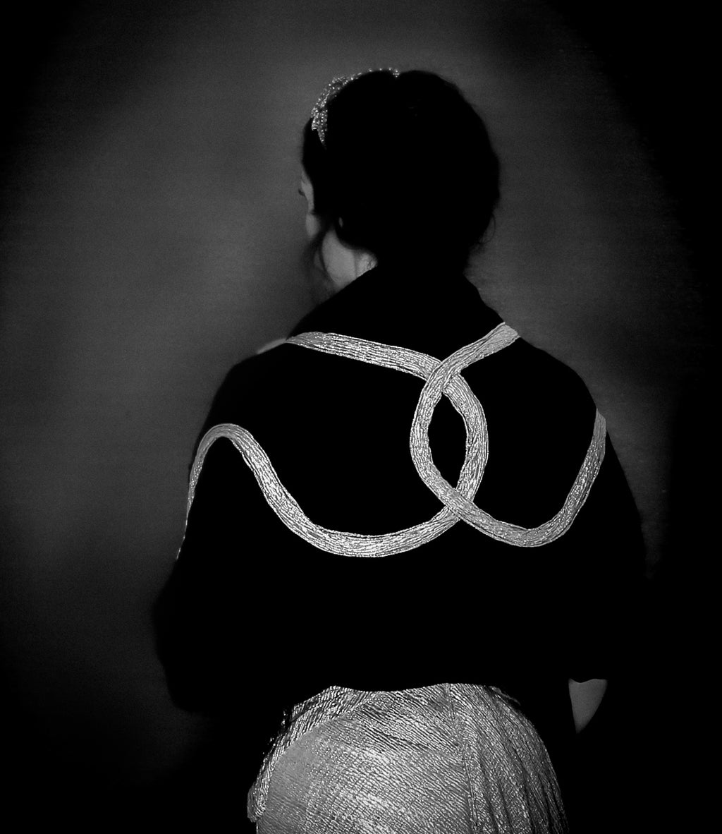 black velvet wrap stole with gold lurex and Swarovski crystal snake design. A one of a kind piece by Alexandra King. The snake charmer wrap. 