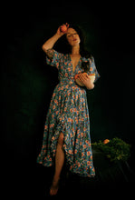 portrait of a women in blue floral dress alexandra king