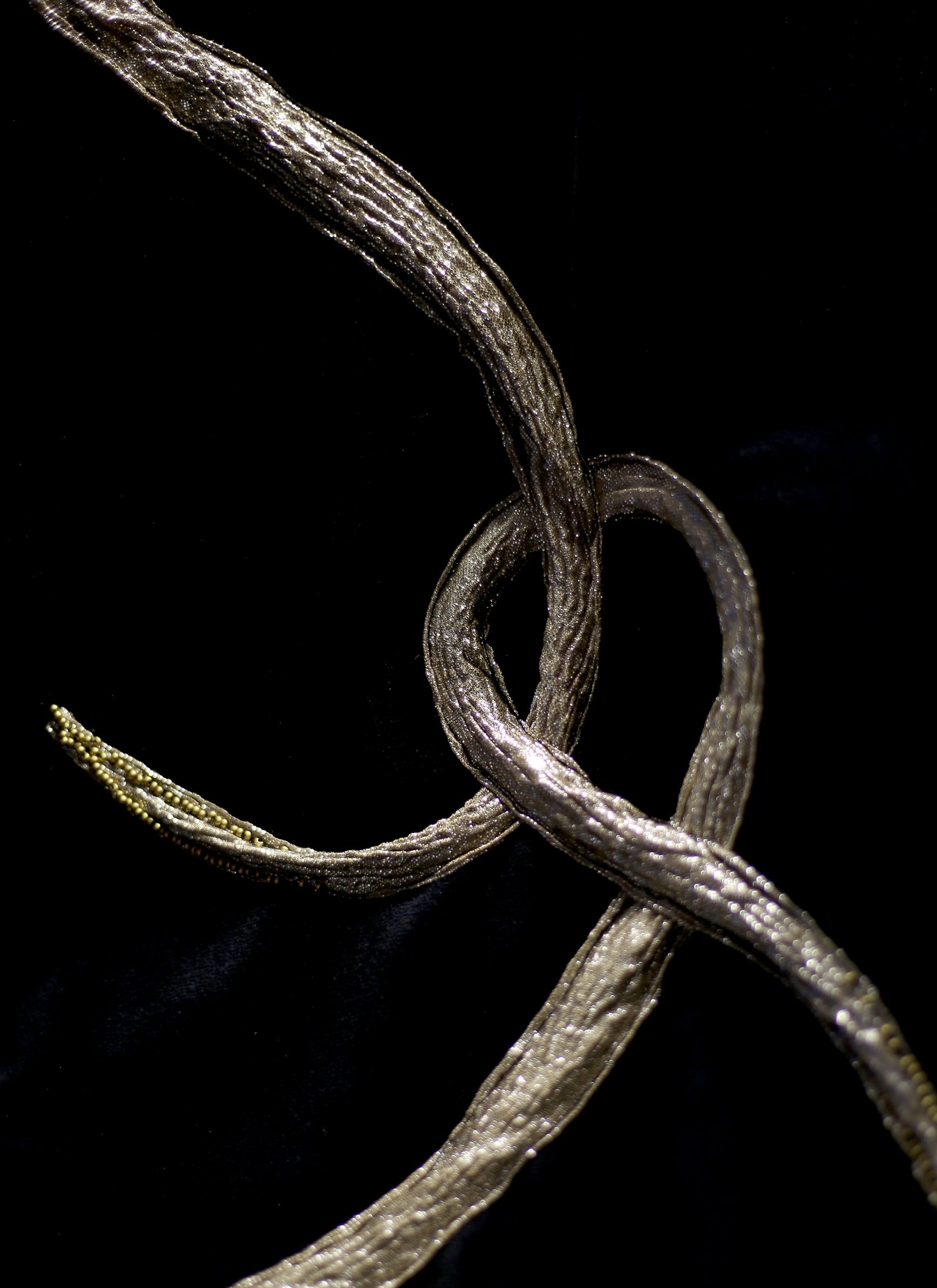 black velvet wrap stole with gold lurex and Swarovski crystal snake design. A one of a kind piece by Alexandra King. The snake charmer wrap. 